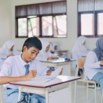 High school students in Indonesia studying in a classroom setting.