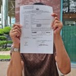 Pengusaha AS menunjukkan bukti laporan polisi atas dugaan penipuan