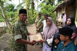 Kegiatan pembangunan balai pengajian dan penyaluran bantuan bagi anak panti asuhan di Aceh