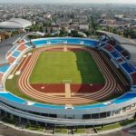 Foto udara Stadion Mandala Krida dengan lapangan hijau dan lintasan lari mengelilinginya.