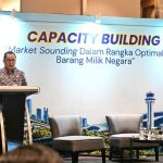 Seorang pejabat berpidato di podium pada acara Market Sounding optimalisasi barang milik negara