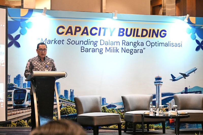 Seorang pejabat berpidato di podium pada acara Market Sounding optimalisasi barang milik negara